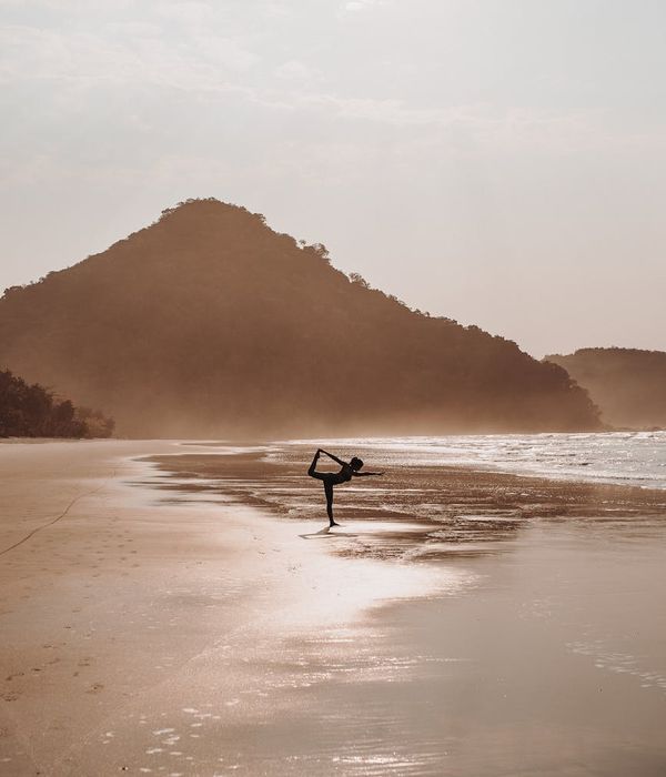 Woman in a serene yoga pose, embodying peace and balance.